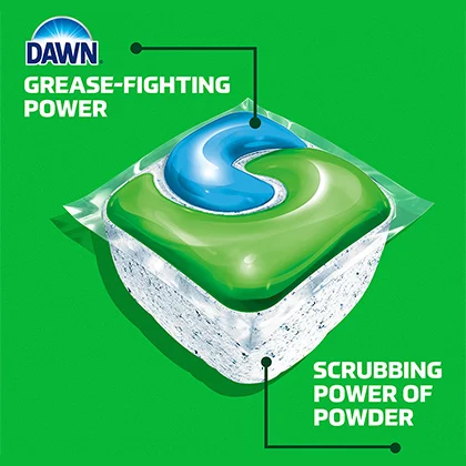 A DAWN dishwashing pod on a green background.