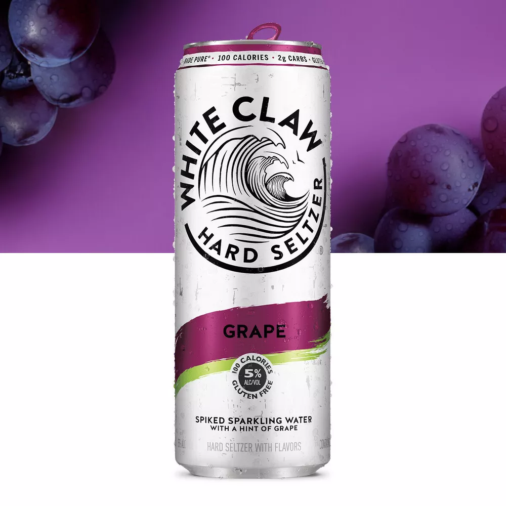 White Claw Hard Seltzer Grape flavor can with grapes in the background