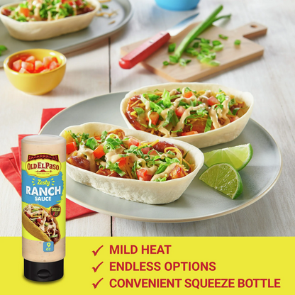 Bowl of salad with Old El Paso Zesty Ranch Sauce on a plate, surrounded by ingredients.